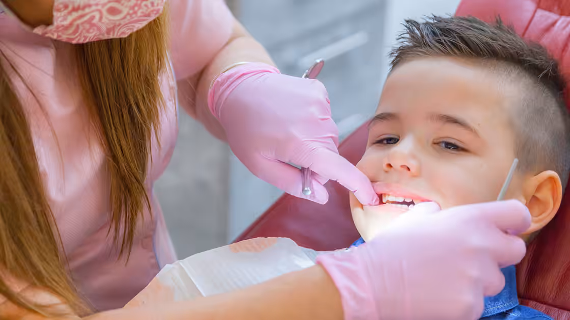 Child in dental chair photo1